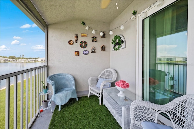 balcony featuring a water view