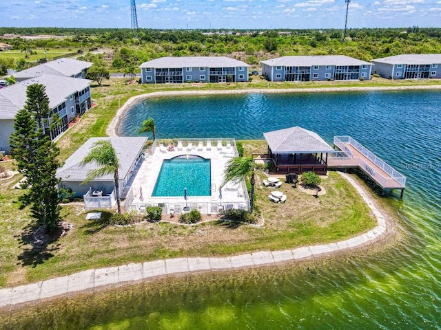 view of swimming pool with a water view and a gazebo