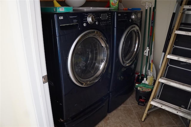 washroom featuring separate washer and dryer and tile patterned flooring