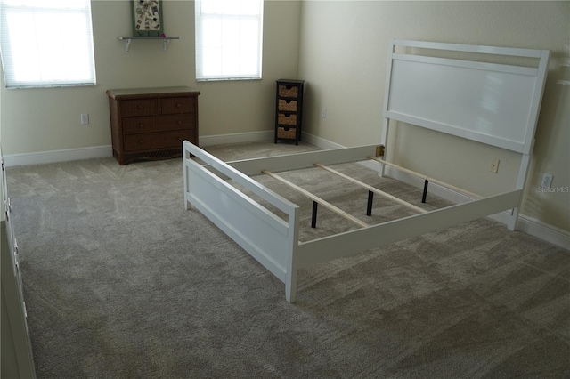 unfurnished bedroom featuring light colored carpet