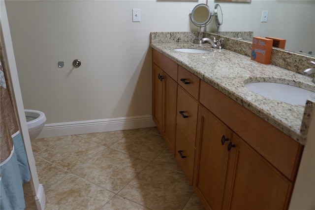 full bathroom featuring tile patterned flooring, a sink, baseboards, and double vanity