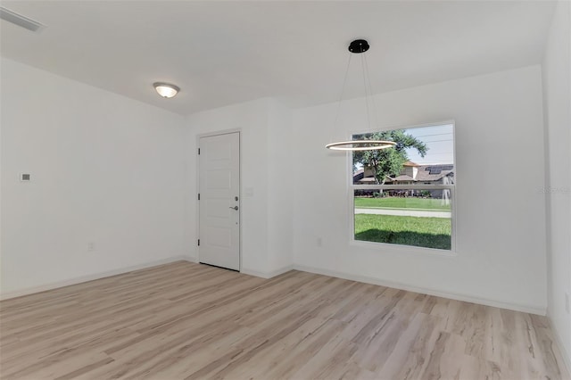 unfurnished room featuring light wood-type flooring