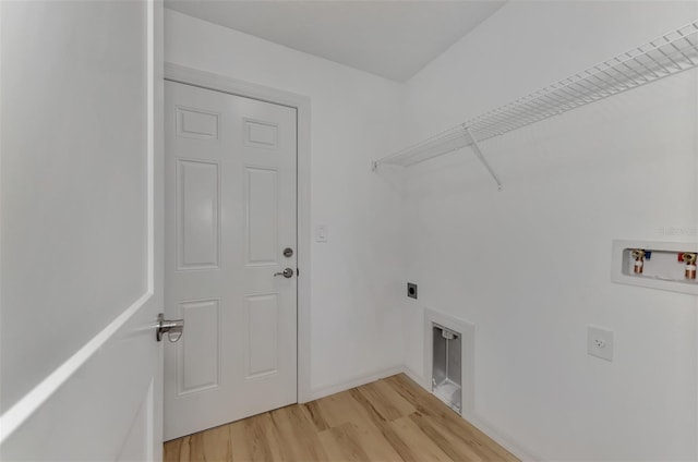 clothes washing area with light hardwood / wood-style flooring, electric dryer hookup, and hookup for a washing machine