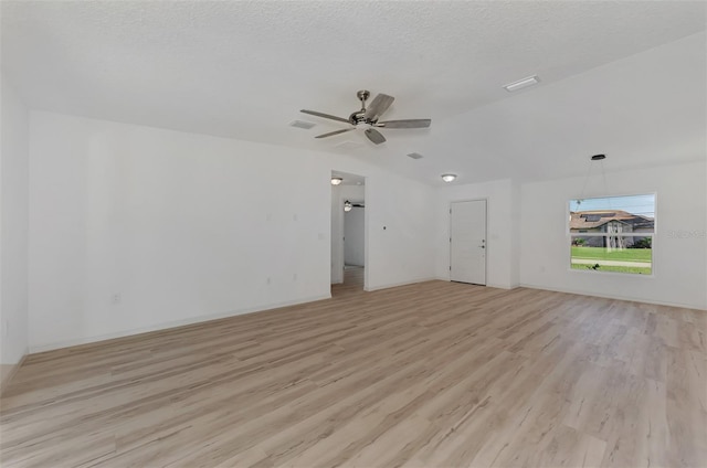 empty room featuring light hardwood / wood-style flooring, a textured ceiling, and ceiling fan