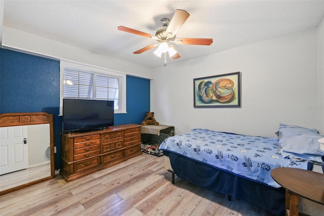 bedroom featuring ceiling fan and light hardwood / wood-style floors