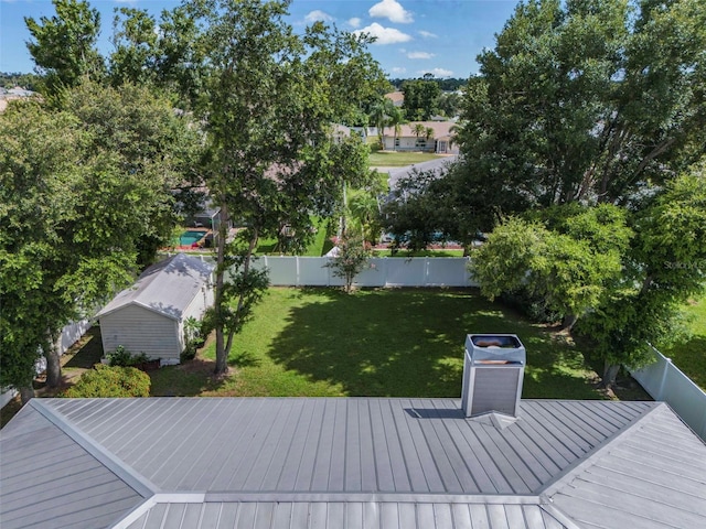 wooden deck with a lawn