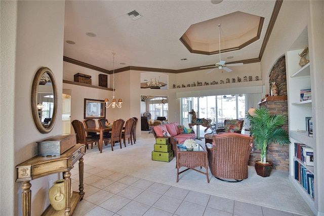 carpeted living room featuring ceiling fan and crown molding