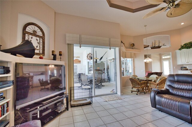 tiled living room featuring ceiling fan