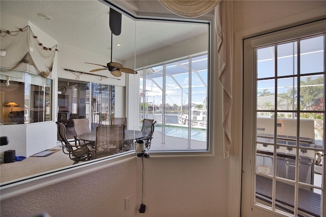 interior space featuring ceiling fan