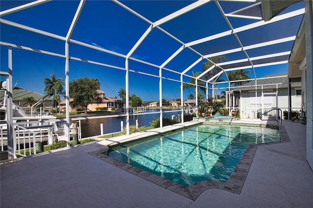 view of pool featuring a lanai, an in ground hot tub, a water view, and a patio area