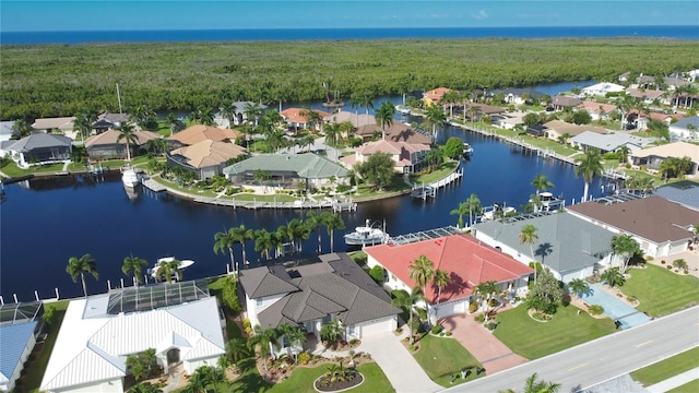 birds eye view of property with a water view