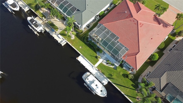 birds eye view of property featuring a water view