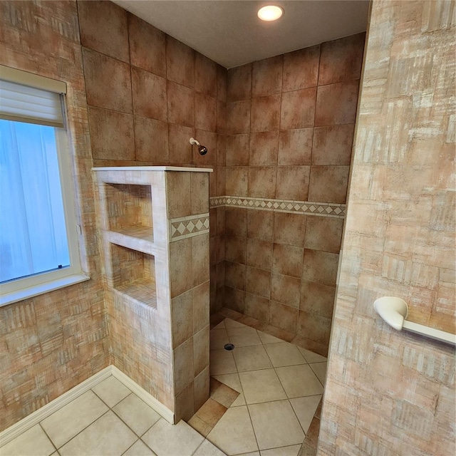 bathroom featuring tile patterned floors and tiled shower