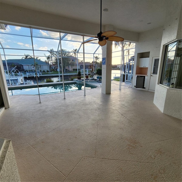 view of swimming pool with ceiling fan