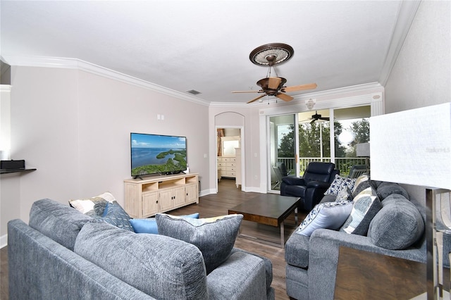 living room featuring ceiling fan, dark wood-type flooring, and ornamental molding