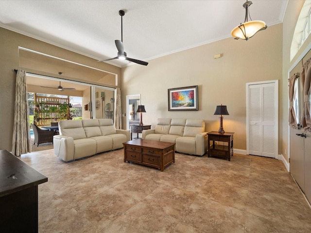 living room with crown molding and ceiling fan