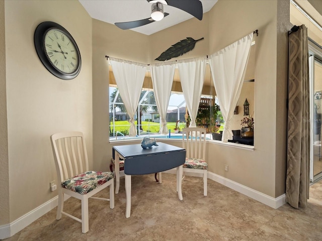 interior space with ceiling fan