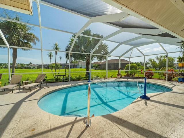 view of pool featuring a yard, a lanai, and a patio