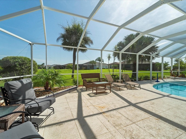 view of patio / terrace featuring a lanai