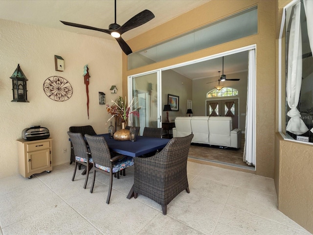 dining space featuring ceiling fan