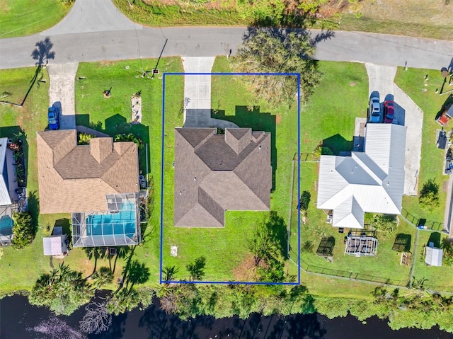 birds eye view of property featuring a water view