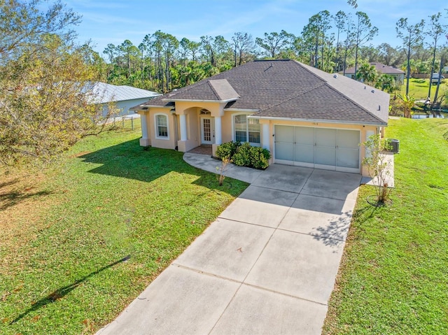 ranch-style house with a garage and a front yard