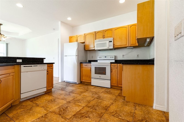 kitchen featuring ceiling fan, white appliances, and tasteful backsplash