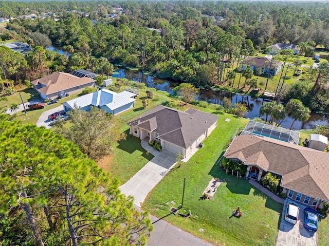 birds eye view of property with a water view