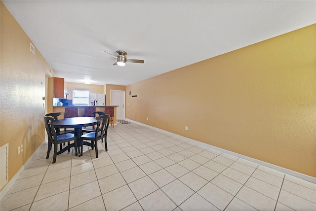 dining space featuring ceiling fan