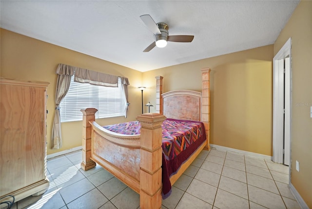 tiled bedroom with ceiling fan