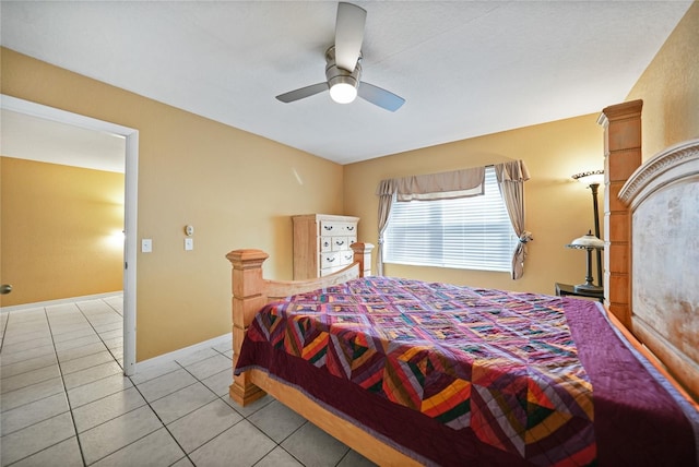 bedroom with ceiling fan and light tile patterned floors