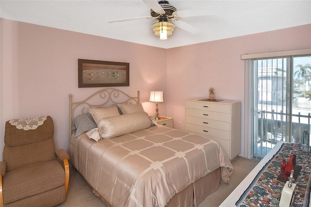 bedroom with light colored carpet, access to exterior, and ceiling fan