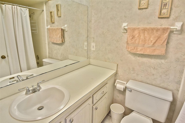 bathroom featuring vanity and toilet