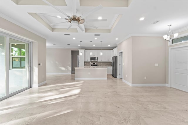 unfurnished living room featuring coffered ceiling, ceiling fan with notable chandelier, ornamental molding, and sink