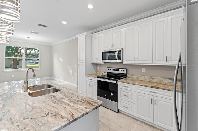 kitchen with a chandelier, stainless steel appliances, and white cabinets