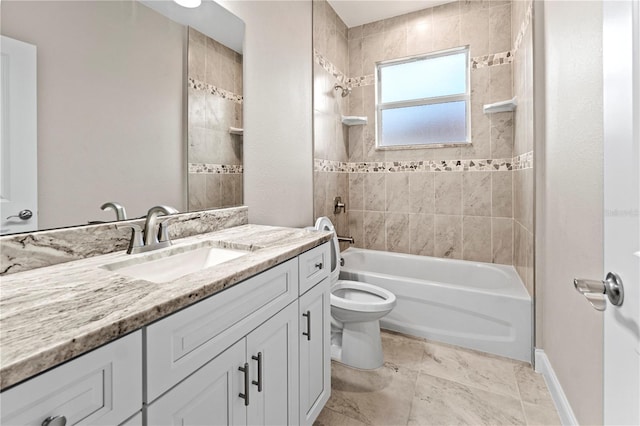 full bathroom featuring vanity, toilet, and tiled shower / bath