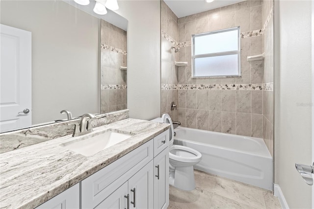 full bathroom with toilet, vanity, and tiled shower / bath