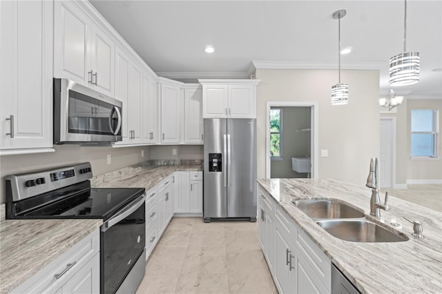 kitchen with white cabinets, sink, stainless steel appliances, and a wealth of natural light