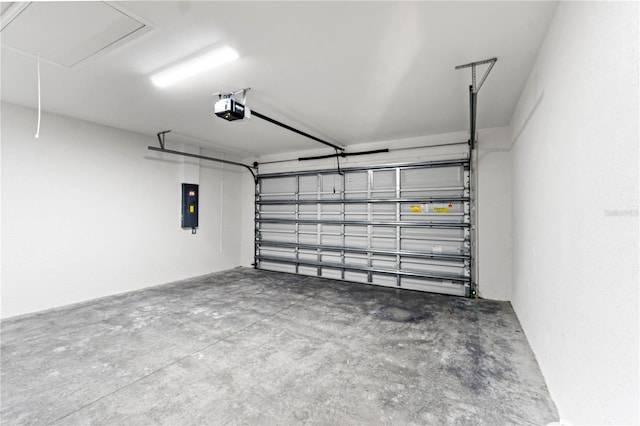 garage featuring electric panel and a garage door opener