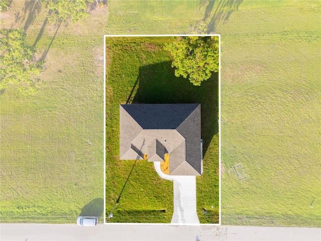 birds eye view of property with a rural view