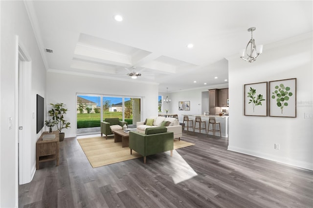 living area featuring ornamental molding, dark wood-type flooring, and recessed lighting