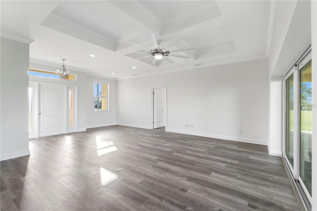 empty room with ornamental molding, a wealth of natural light, and baseboards