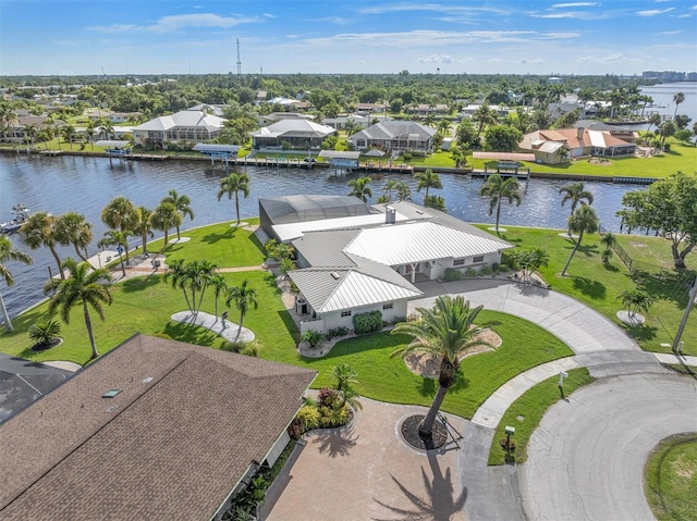 birds eye view of property with a water view