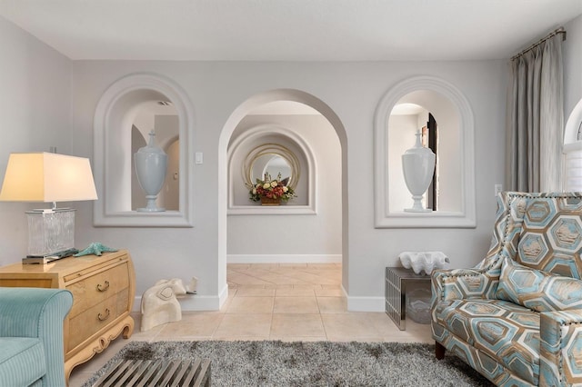 living area with light tile patterned floors