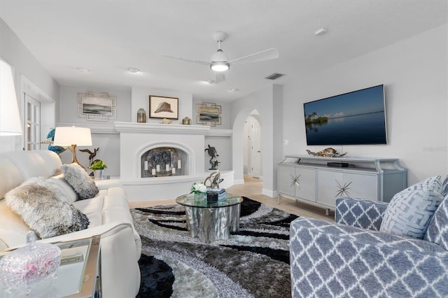 living room featuring hardwood / wood-style floors and ceiling fan