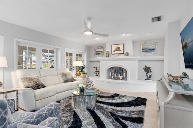 living room with light tile patterned floors and ceiling fan