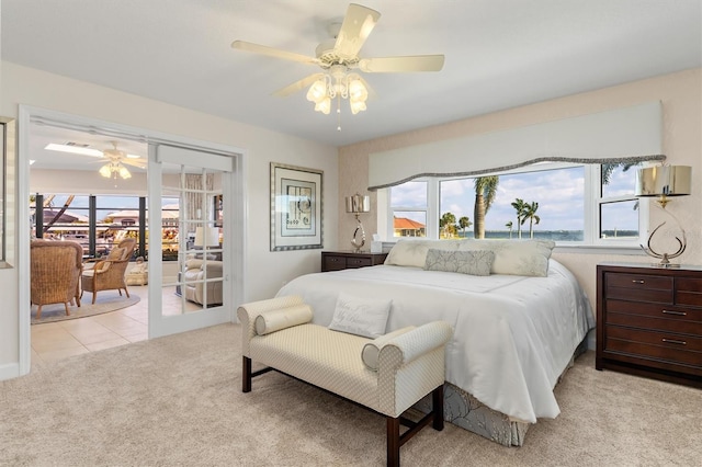 bedroom with light colored carpet and ceiling fan