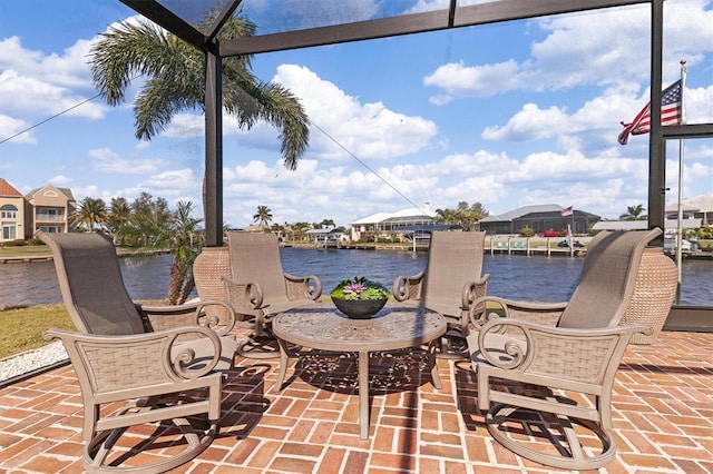 view of patio with a water view