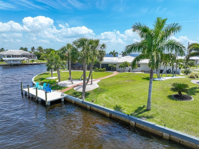 view of dock featuring a water view and a lawn