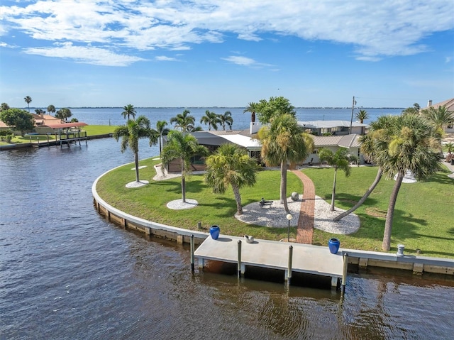 exterior space featuring a water view and a yard